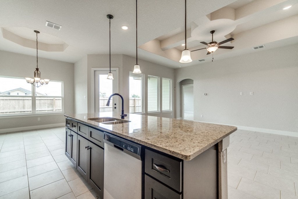 a kitchen with a counter top and a sink