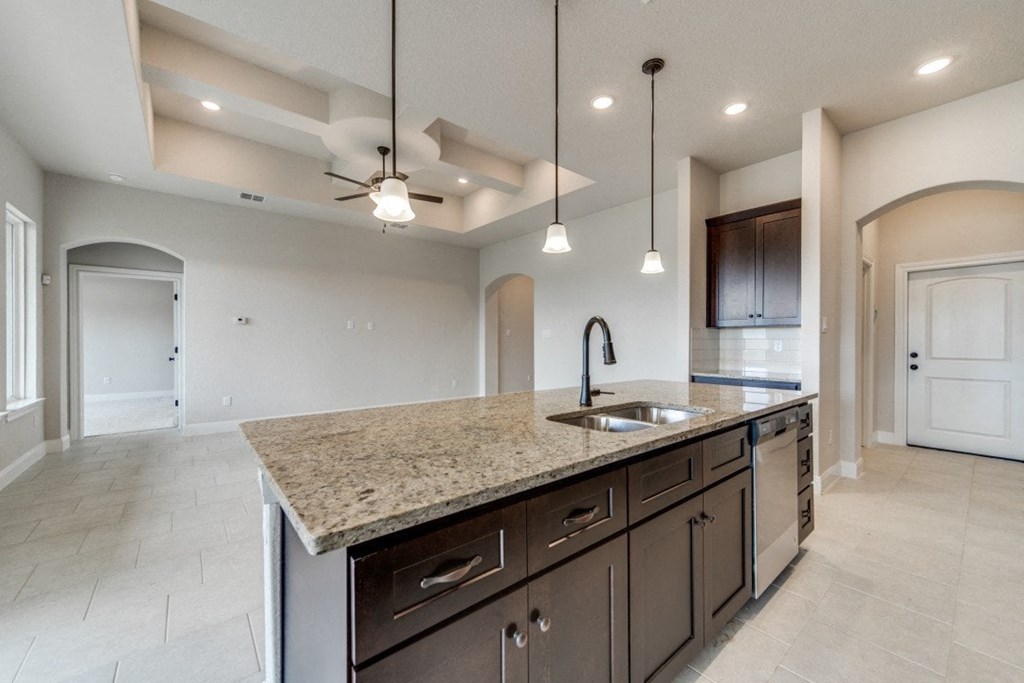 a kitchen with a sink and a counter top