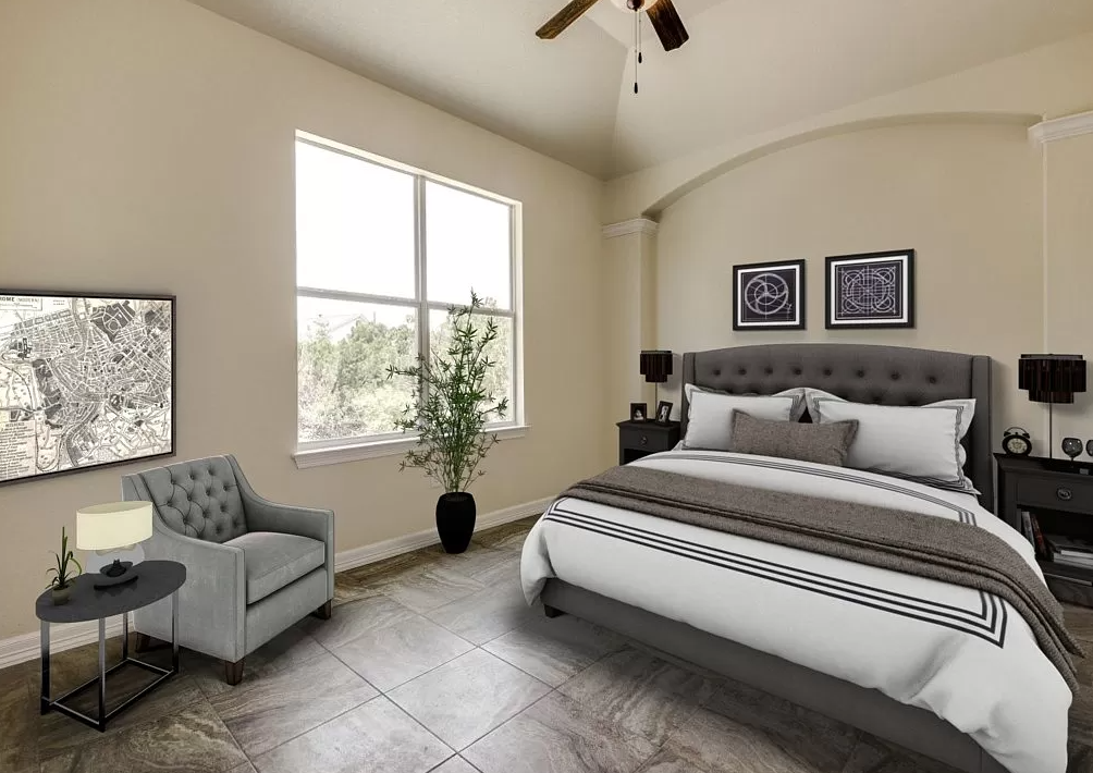 a bedroom with a bed and a chair