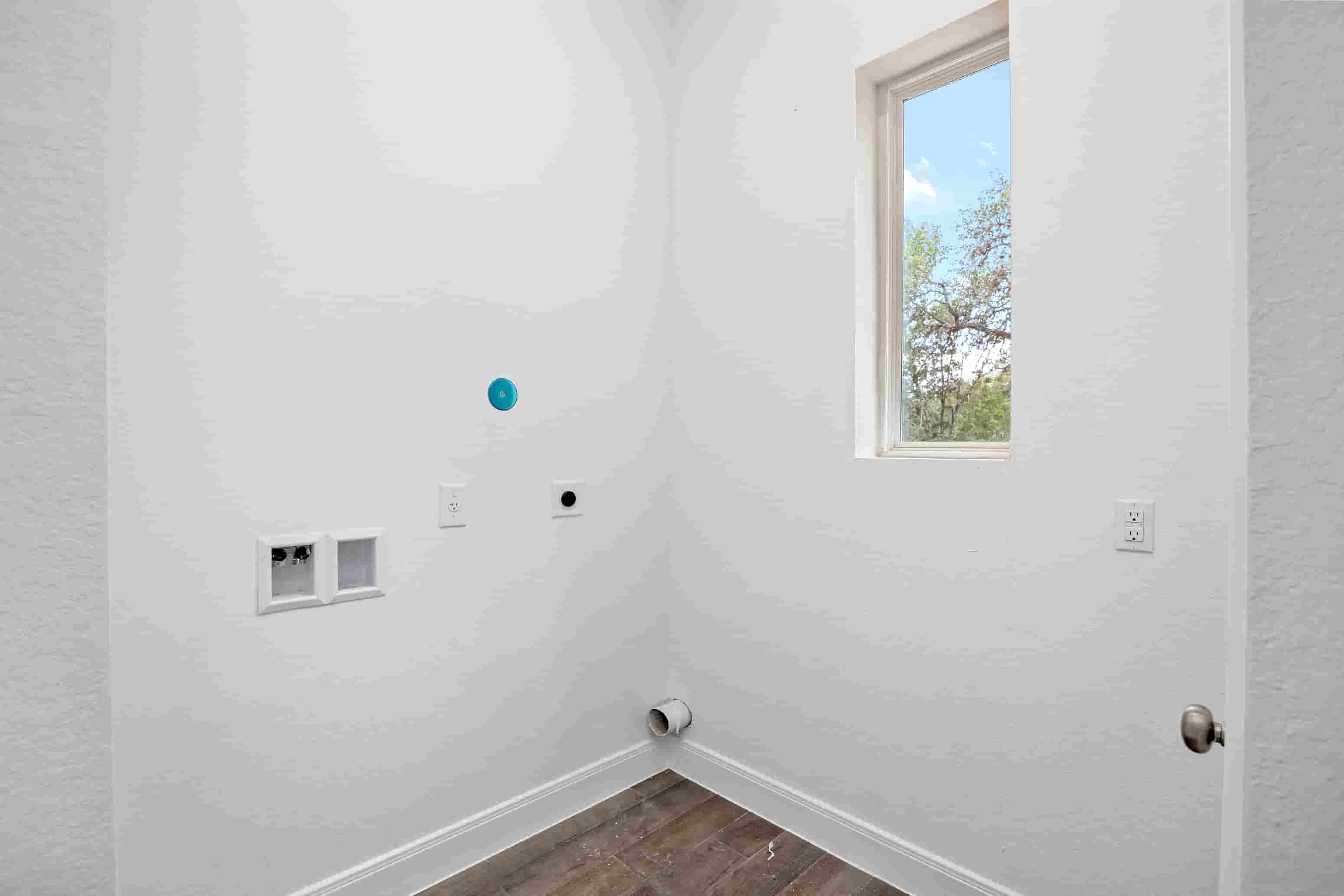 a room with white walls and a window