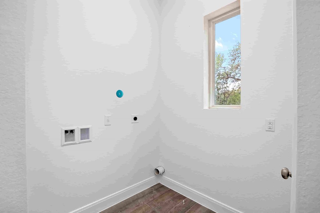 a room with white walls and a window