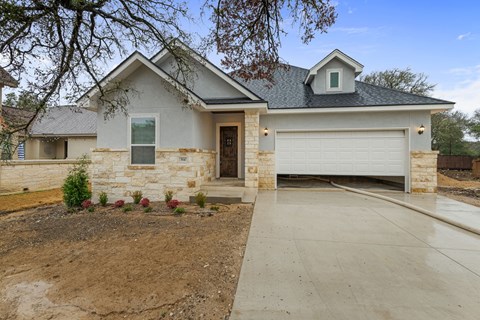 a house with a driveway and a garage door