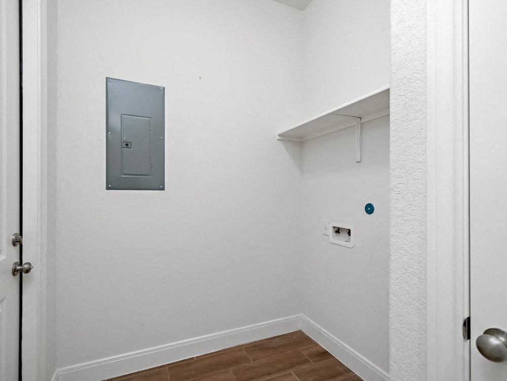 a white room with a white door and a white wall and a door to a