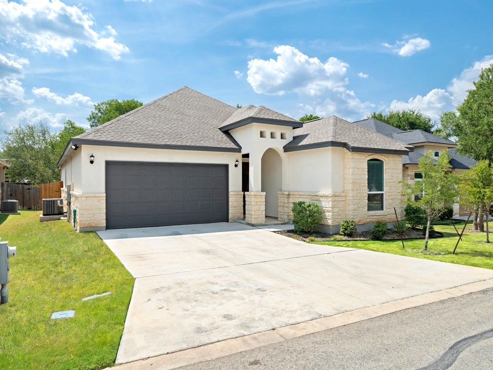 a house with a driveway and a garage door