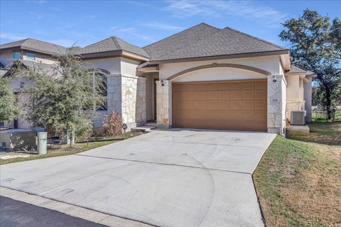 a house with a driveway and a garage door