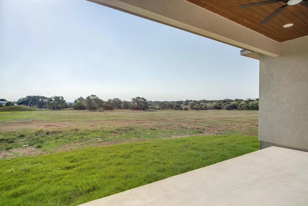 a view of a field from a patio
