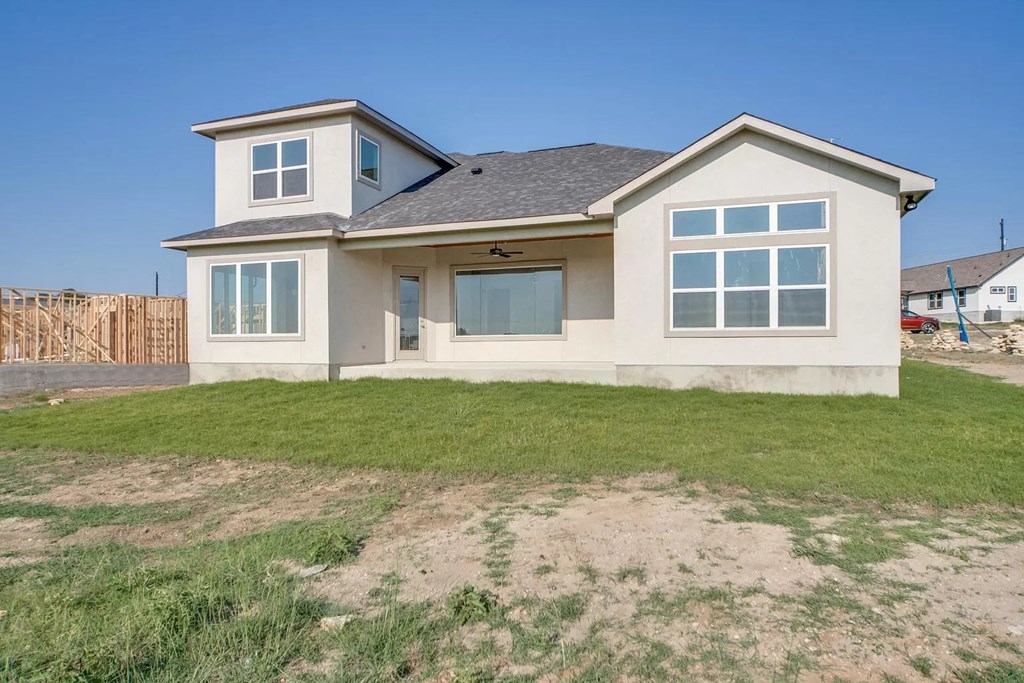 a house with a lawn in front of it