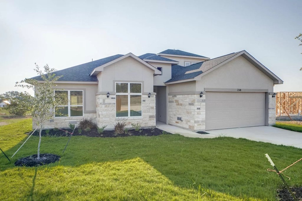 a house with a garage and a lawn