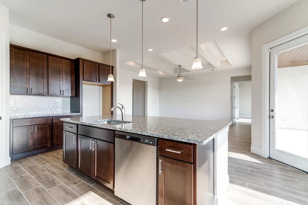 a kitchen with a sink and a counter top