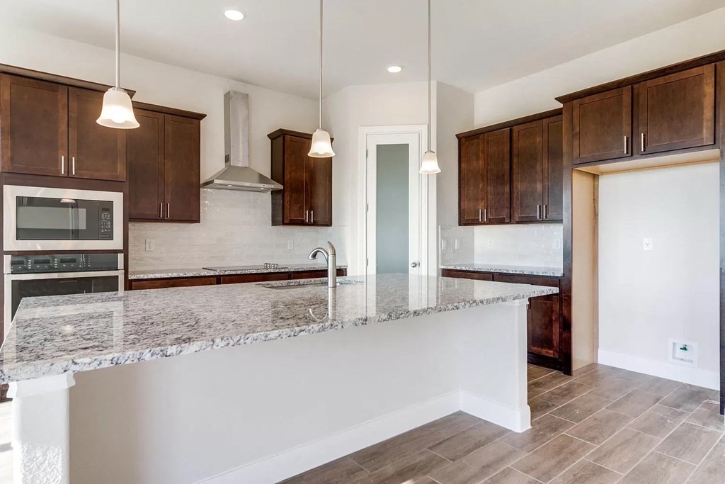 a kitchen with a counter top and a sink