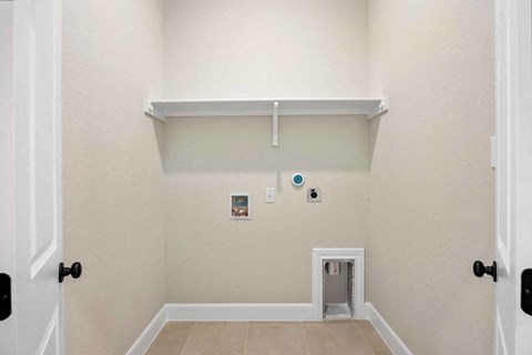 the entrance to a room with a white wall and a door