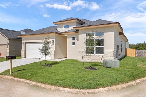 a house with a lawn in front of it