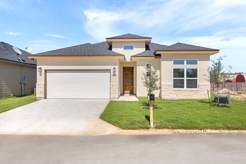 a house with a driveway and a garage door