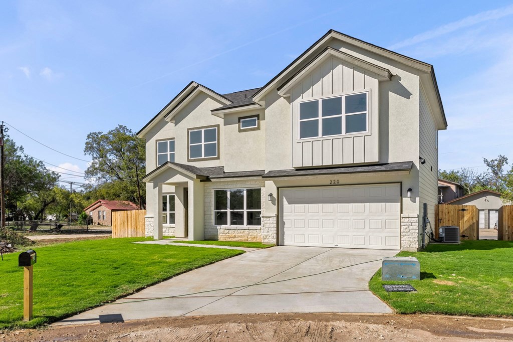 a house with a white garage door and a driveway