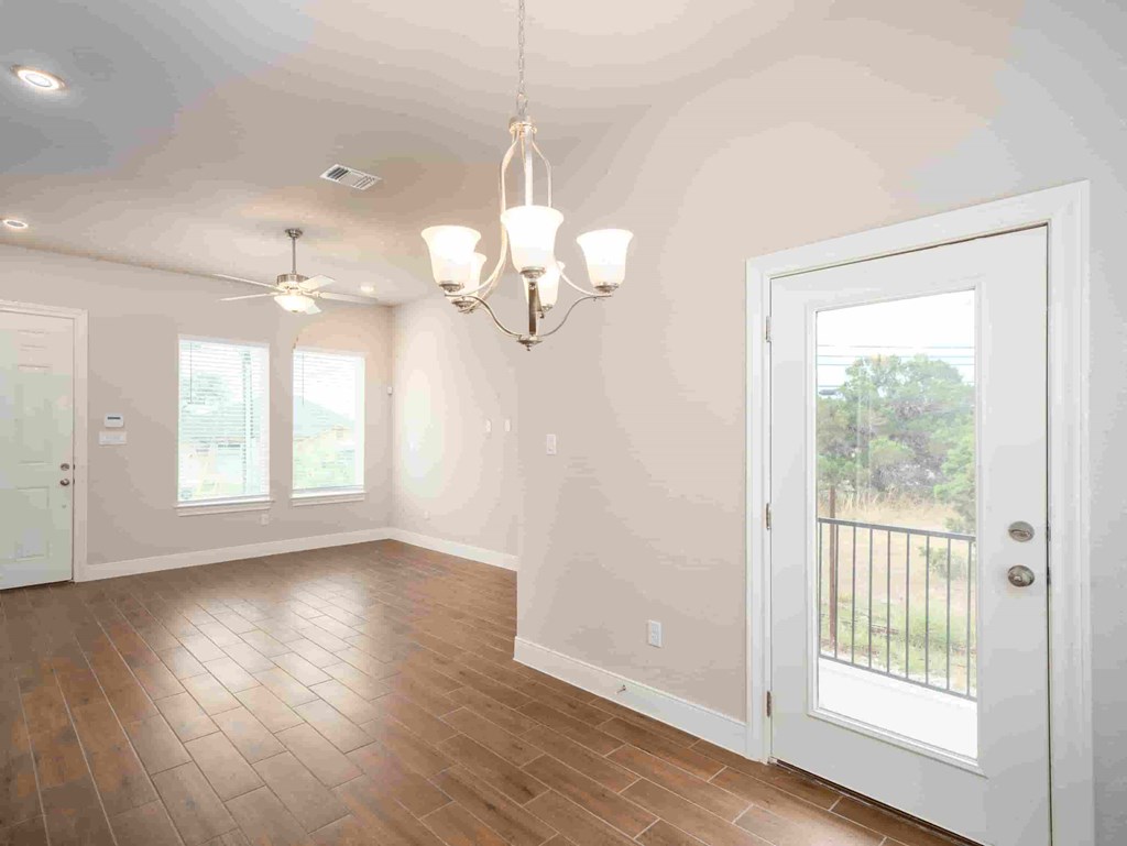 the dining room is open to the kitchen and living room