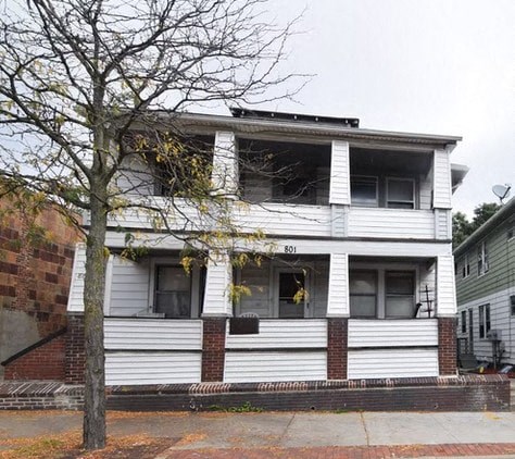 A white two story house with the number 801 on the front.