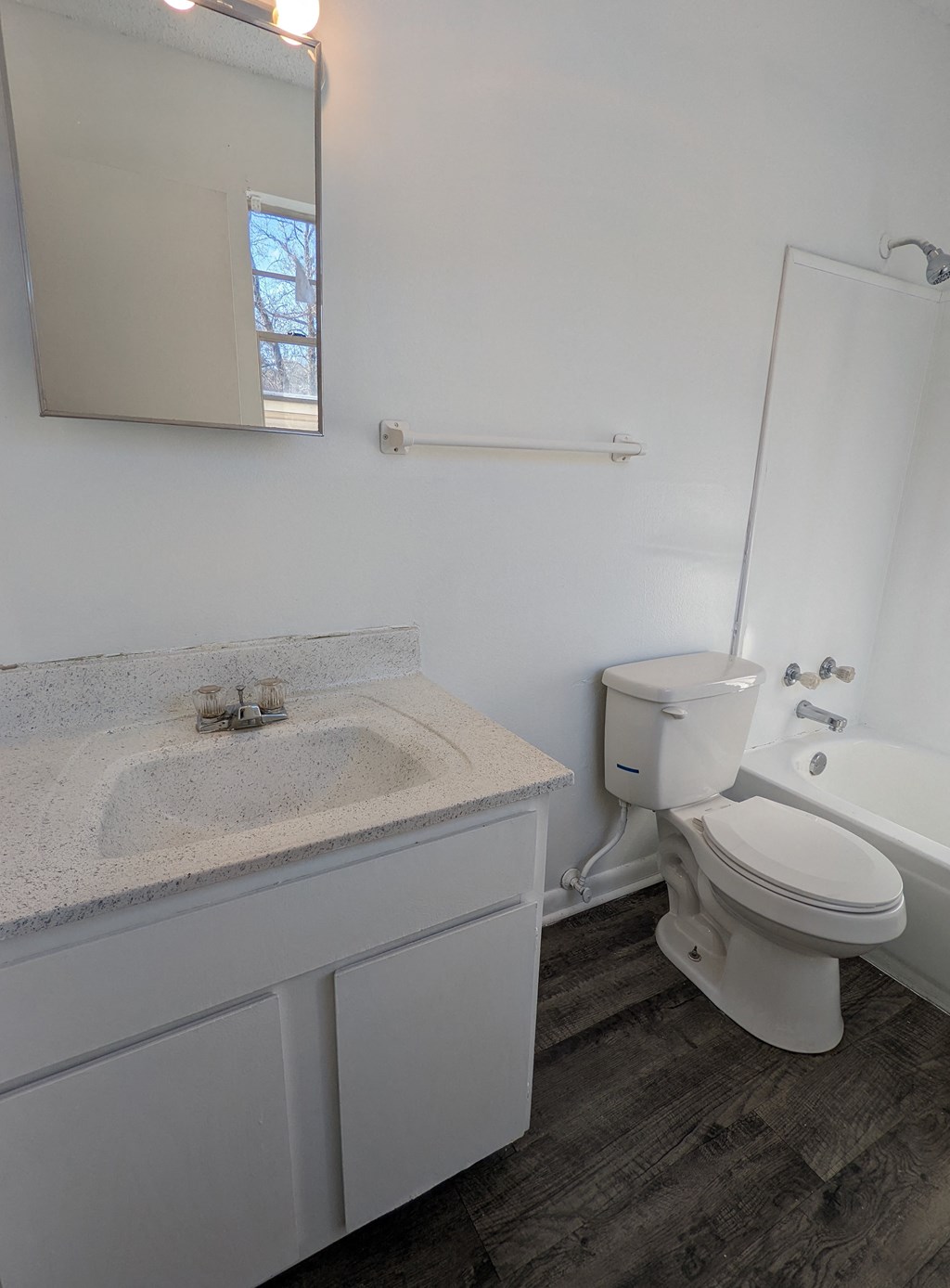 an empty bathroom with a toilet and a sink