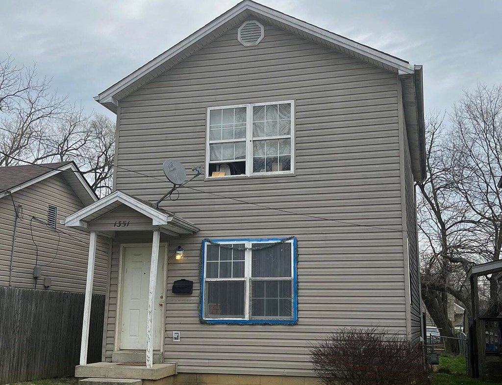 a house with a satellite dish on the side of it