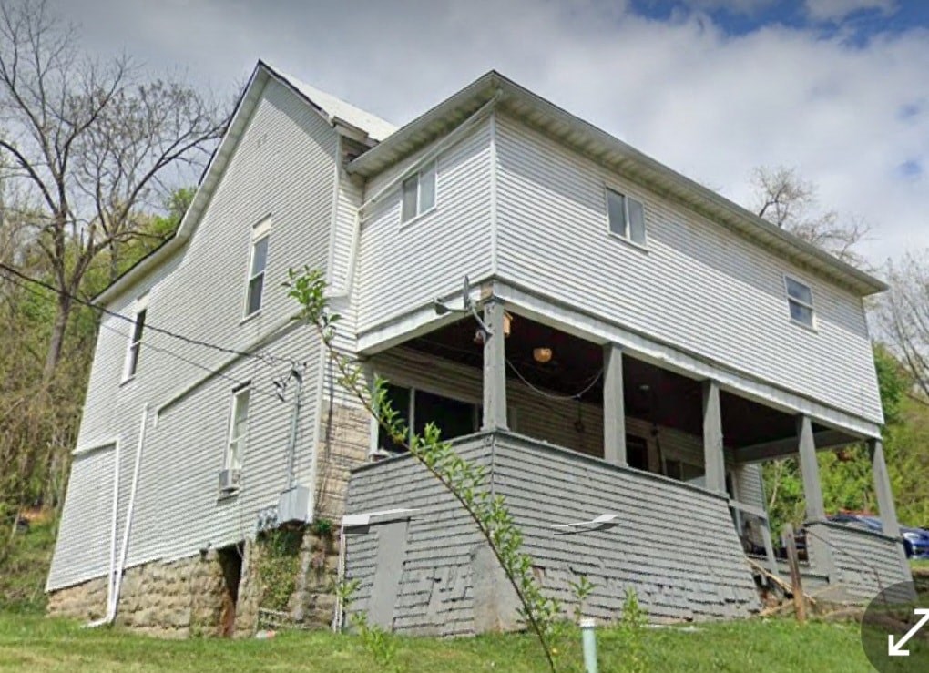 an old house with its roof torn off