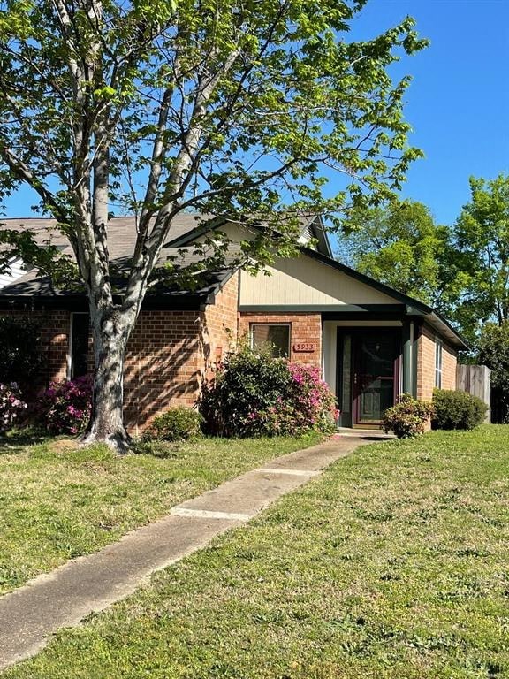 A house with a tree in front of it.