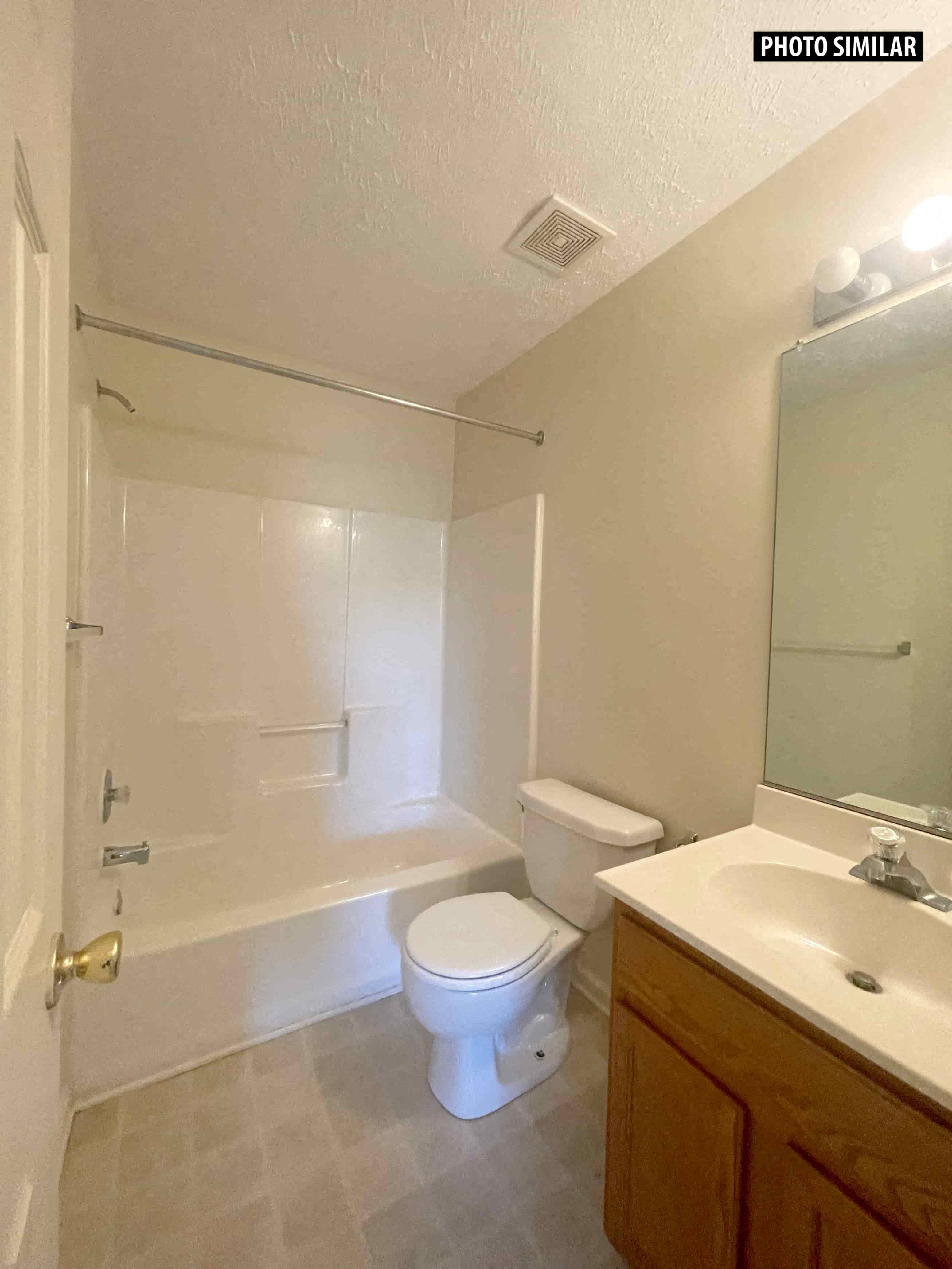 a bathroom with a toilet and a sink