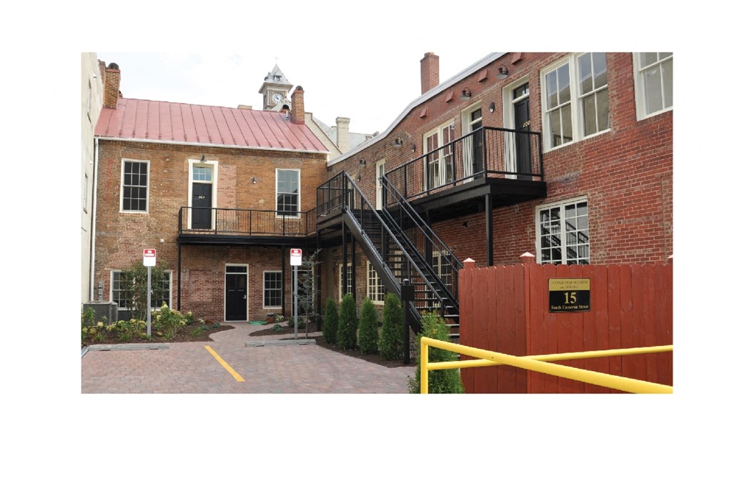 the entrance to a brick building with a staircase