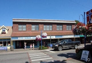 A street view with a building that has a sign that says "The North Pole".