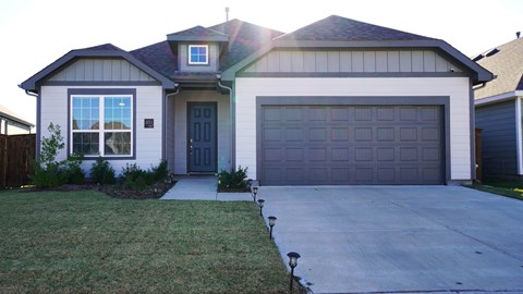 a garage door in front of a house