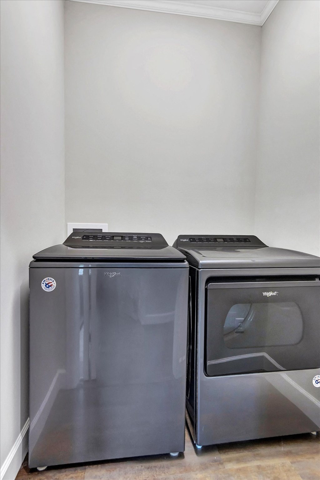 the utility room has a washer and dryer and a refrigerator