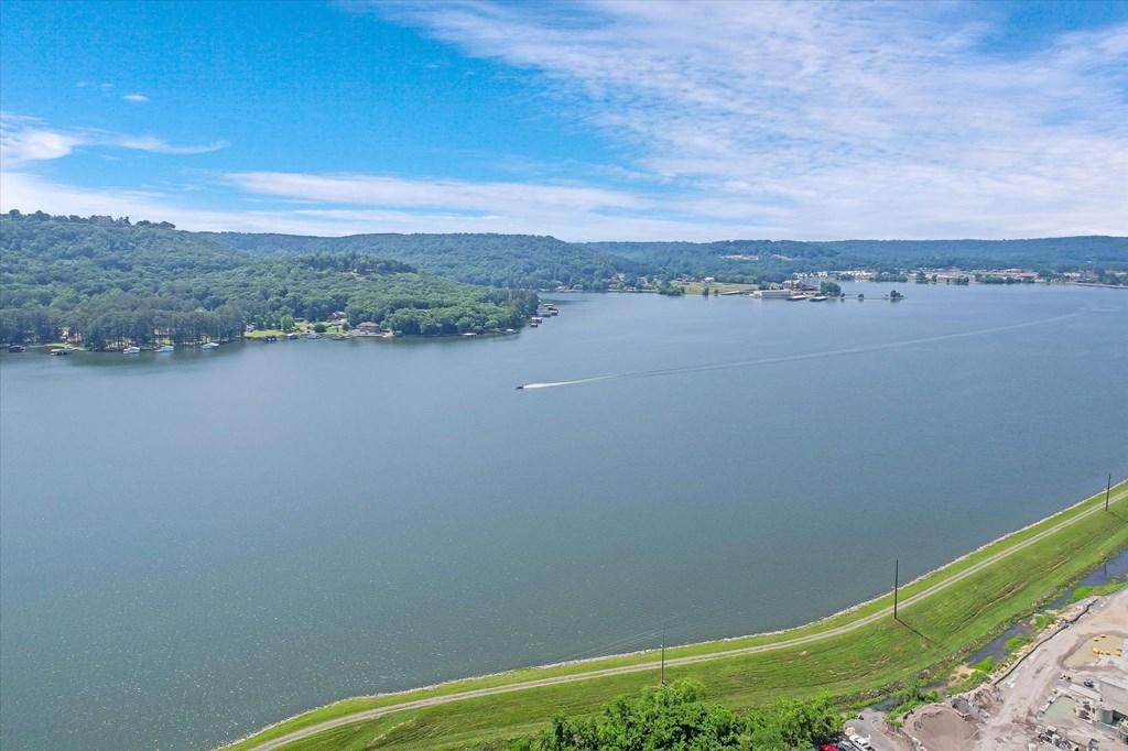 arial view of a body of water with mountains in the background