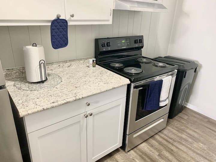 a kitchen with a stove and a counter top