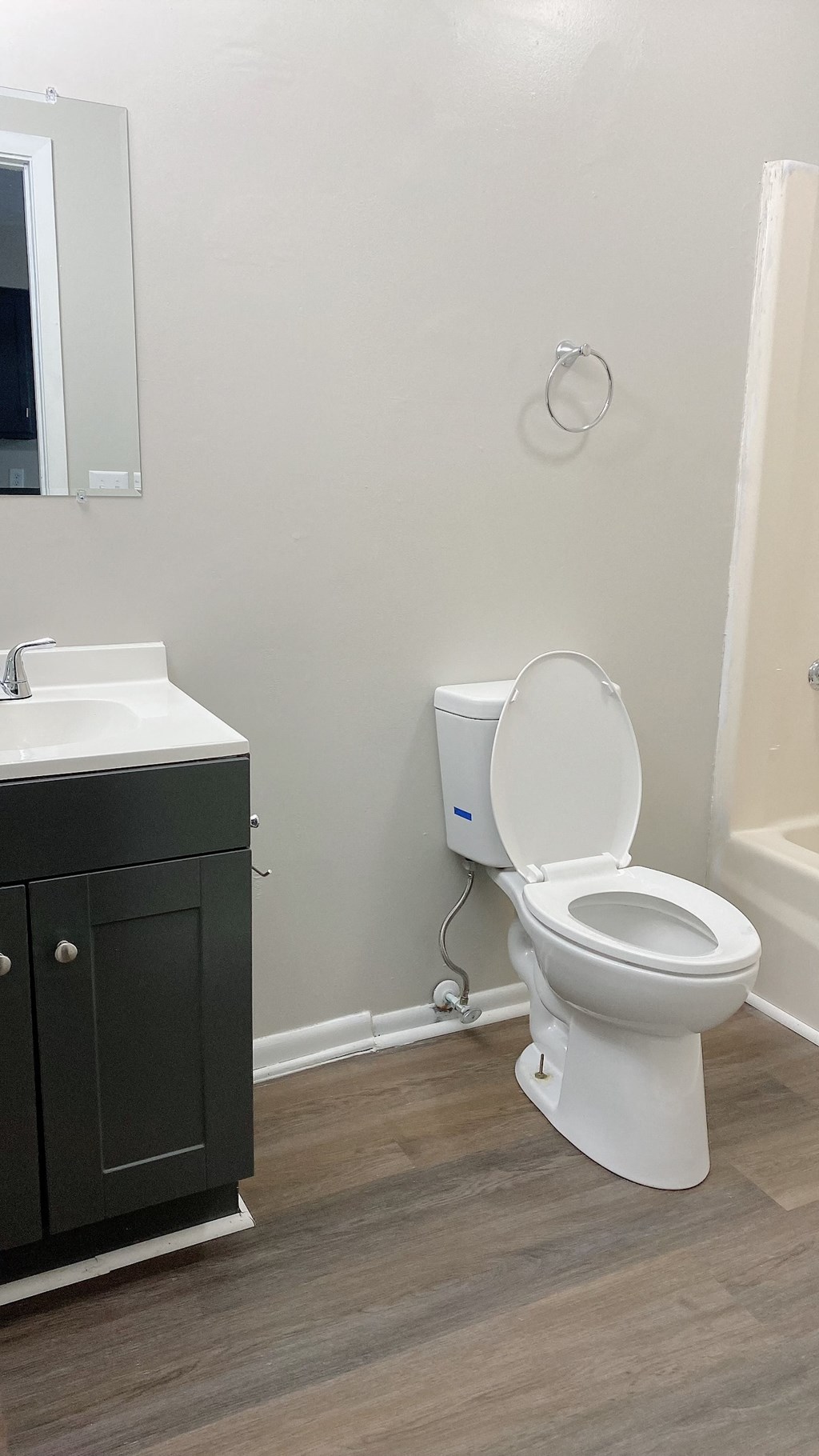 an empty bathroom with a toilet and a sink