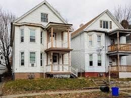 two white houses sitting next to each other
