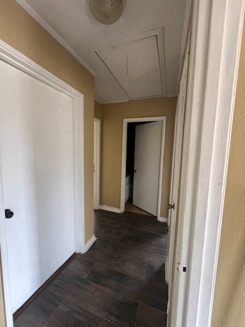 a hallway with a tile floor and a white door