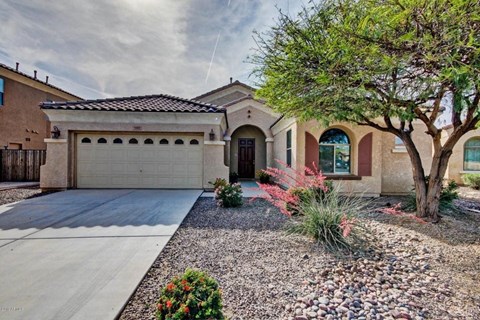 a house with a driveway and a garage door