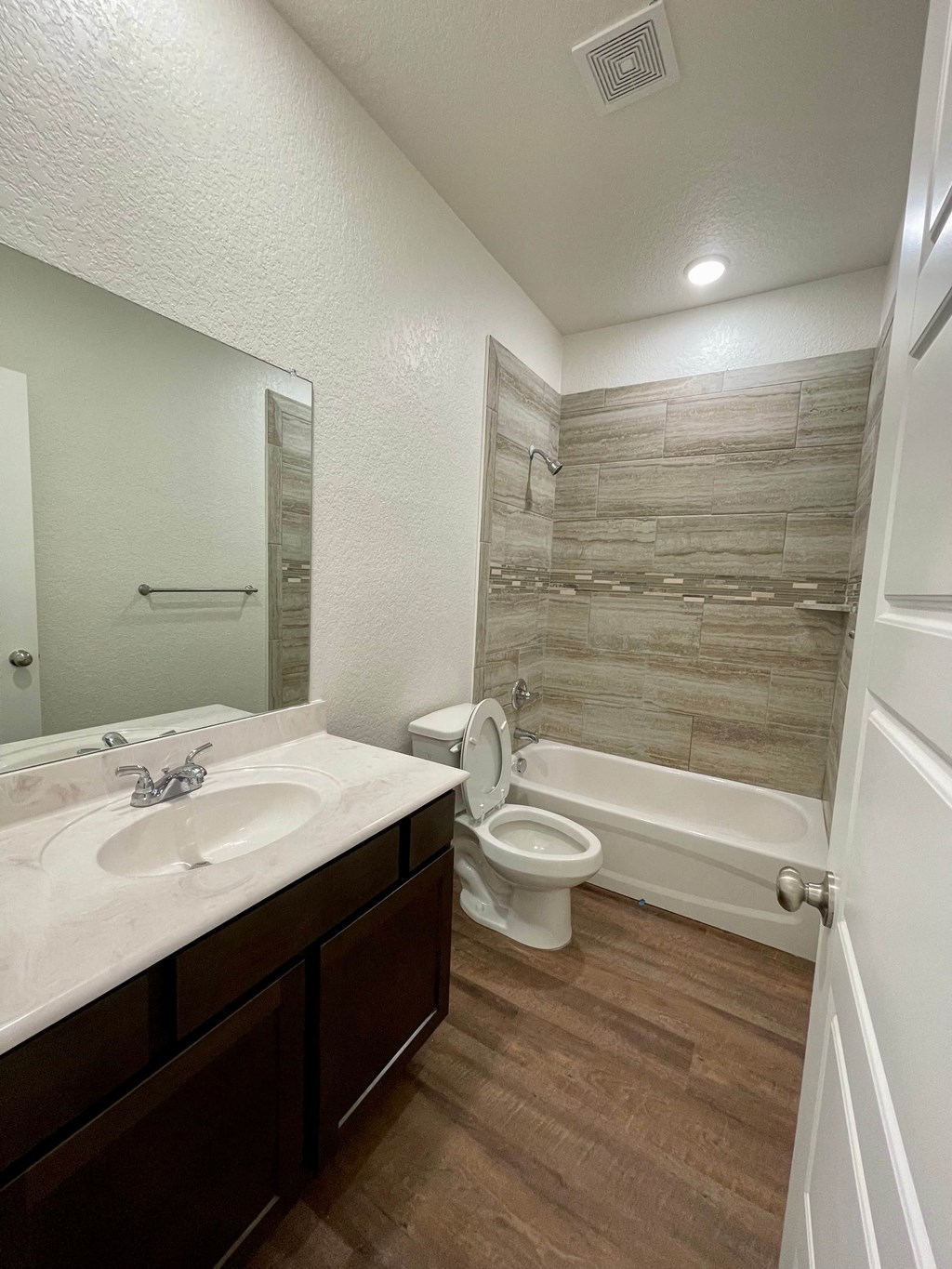 a bathroom with a sink toilet and a bath tub