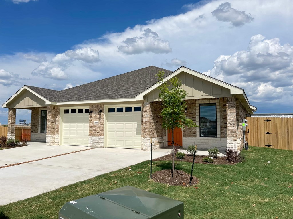 a house with a garage and a lawn