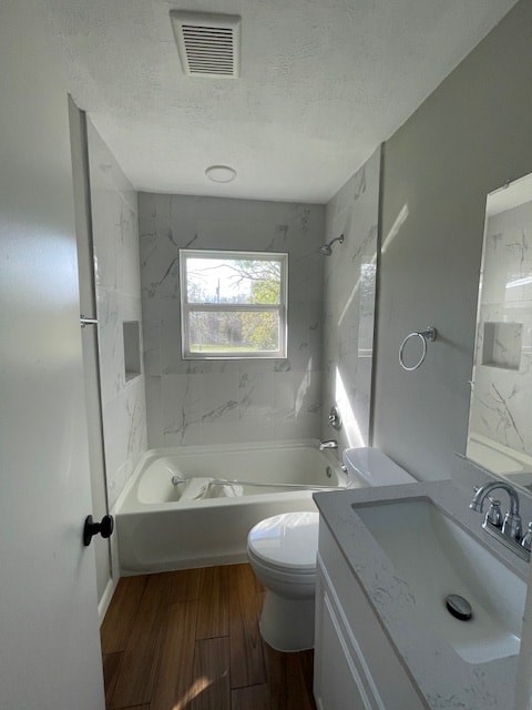 a white bathroom with a tub and a toilet and a sink