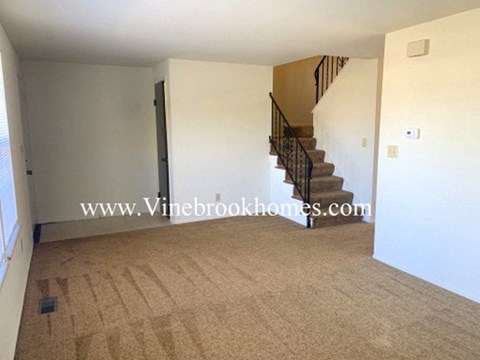 a view of the living room and staircase to the second floor
