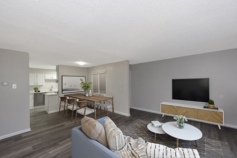 a living room with a couch and a table with a television