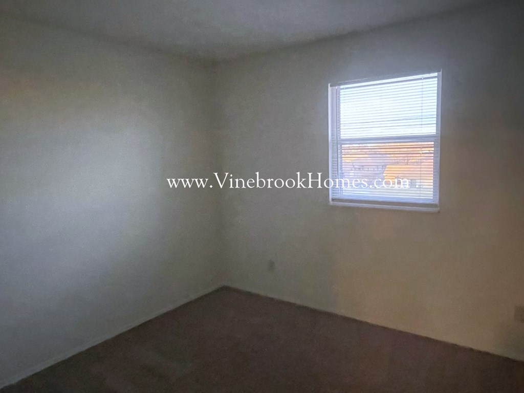 an image of a bedroom with a window