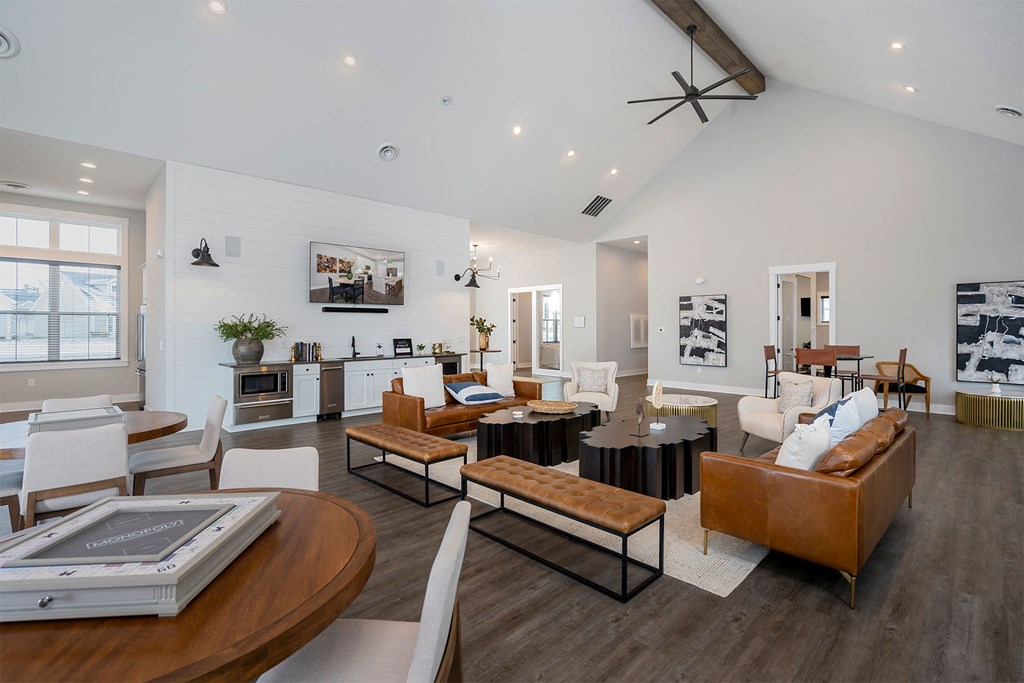 a living room with couches and chairs and a table
