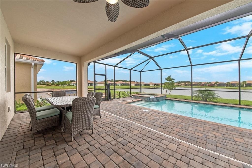 a patio with a pool and a table and chairs