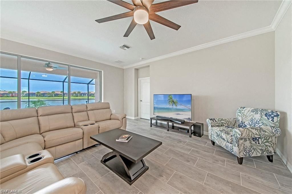a living room with a couch and a tv