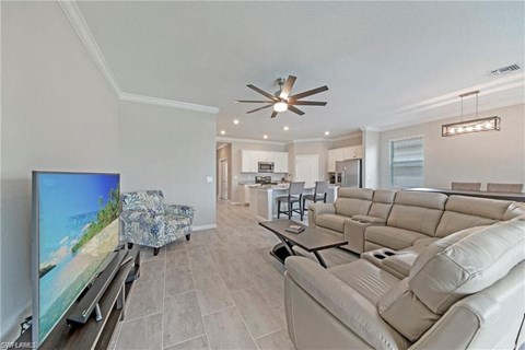 a living room with a couch and a tv