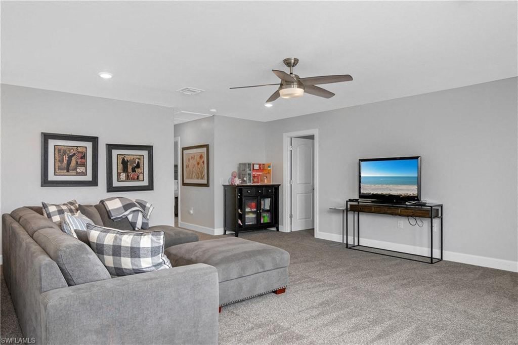 a living room with a couch and a tv