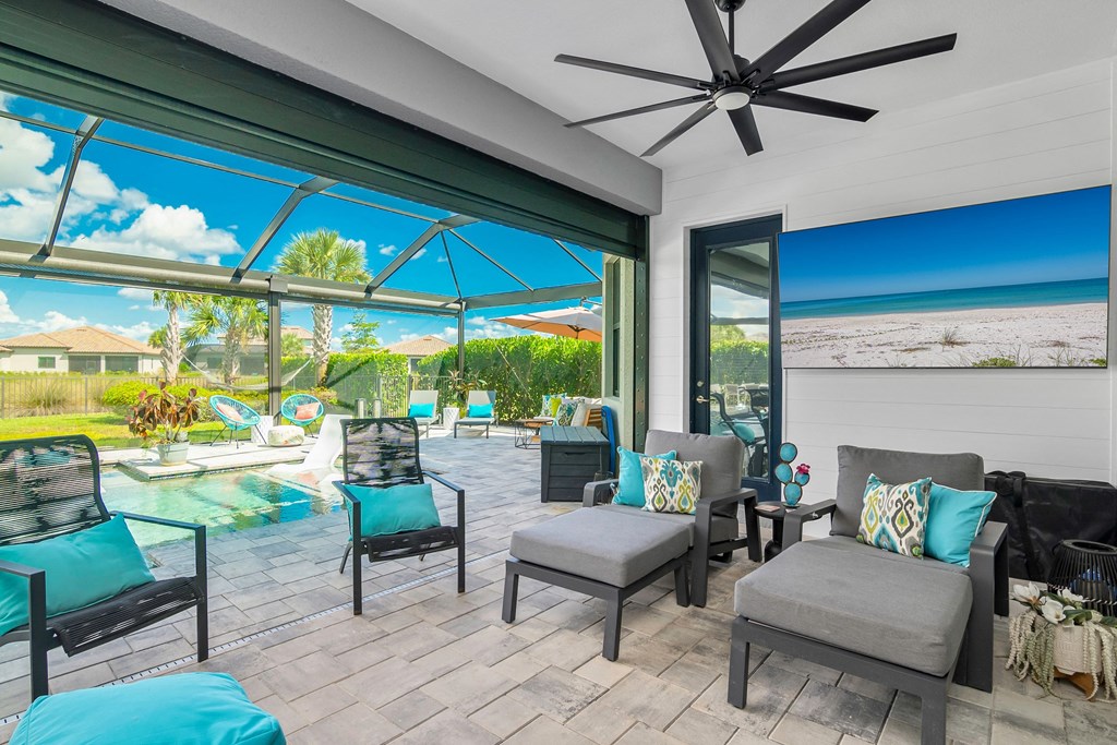 a patio with a pool and a view of the ocean