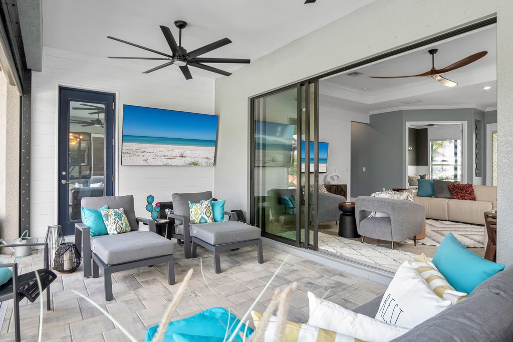 the living room has a large sliding glass door out to the beach