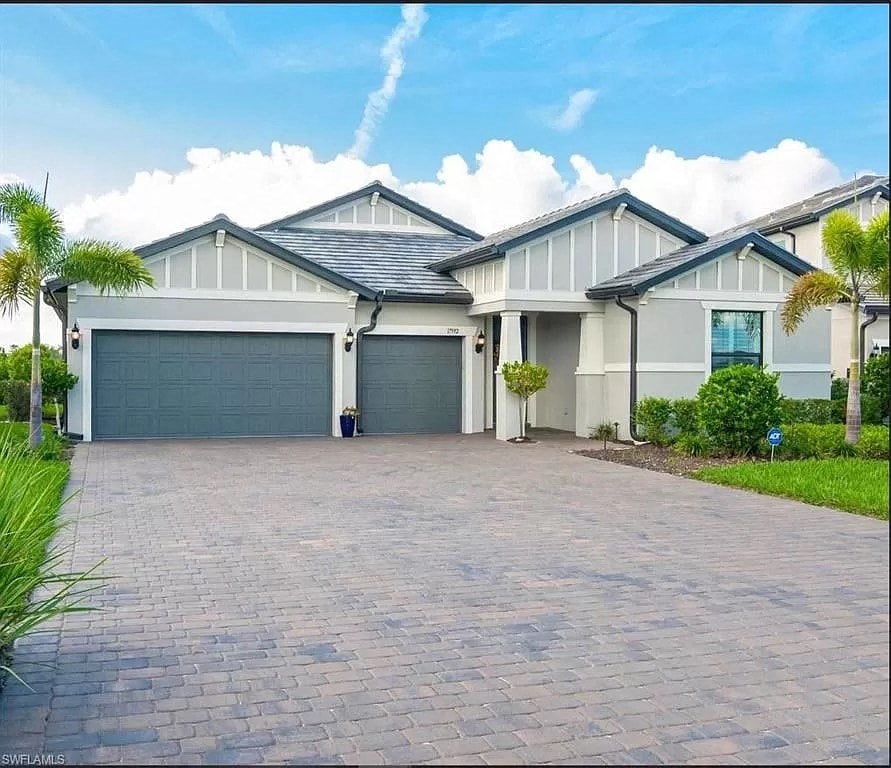 a house with a driveway and a garage door