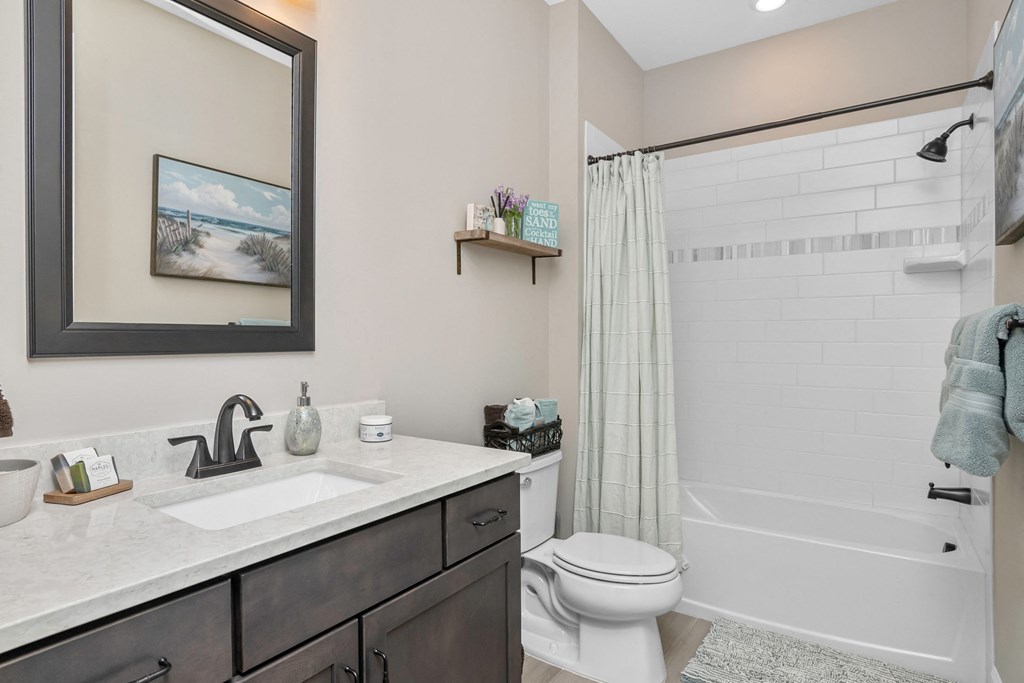 the residence on lamar apartment bathroom with shower sink and toilet